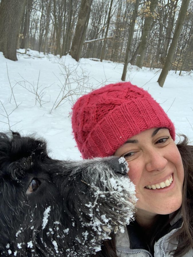 ELA teacher Mrs. Erin Meade enjoying a snow day last year with her dog, Stanley.