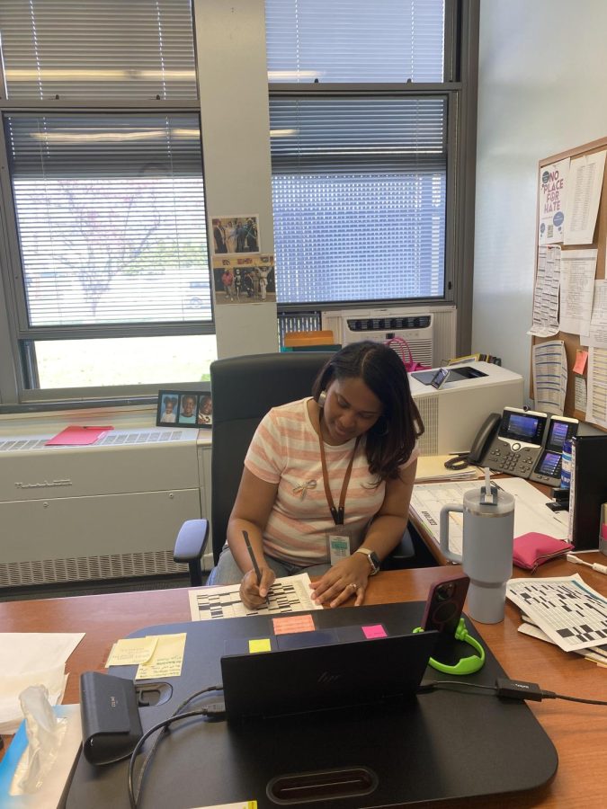 Mrs. LaNova Schall working in her office at EIS.