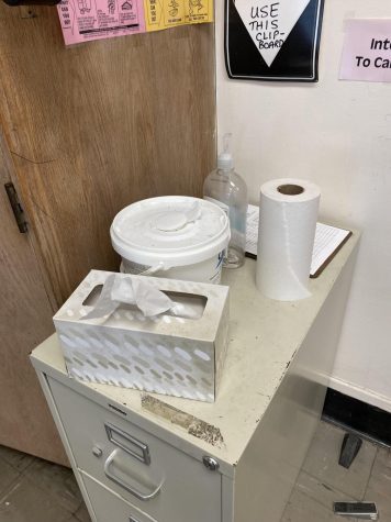 Stations with hand sanitizer and industrial wipes still featured in classrooms are remnants of coronavirus precautions in schools. 