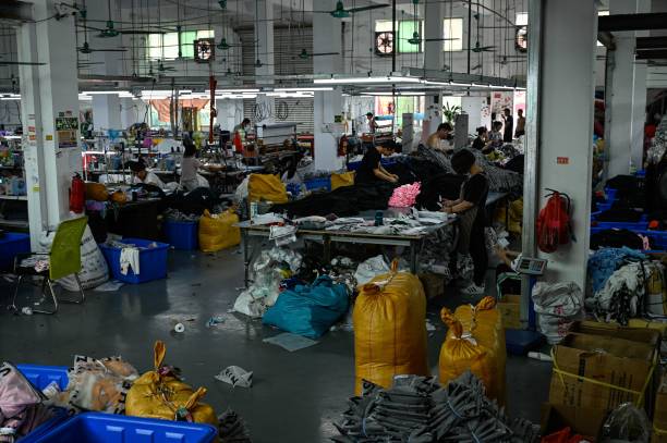 Workers make clothes at a garment factory that supplies SHEIN, a cross-border fast fashion e-commerce company in Guangzhou, in Chinas southern Guangdong province on July 18, 2022. (Photo by Jade Gao / AFP) (Photo by JADE GAO/AFP via Getty Images)