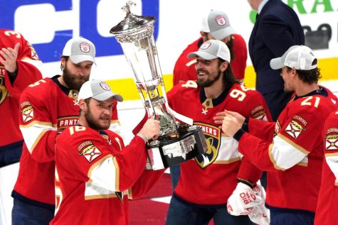 The Florida Panthers touch the Prince of Wales Trophy as Eastern Conference Champions.