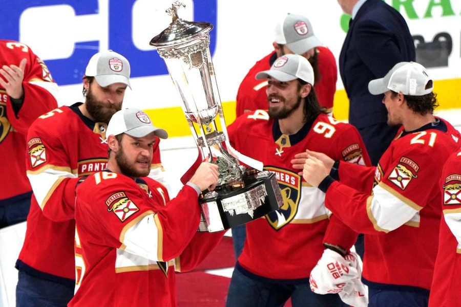 The Florida Panthers touch the Prince of Wales Trophy as Eastern Conference Champions.