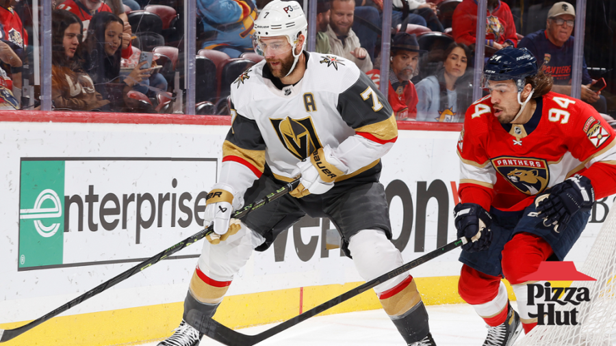 Vegas+Golden+Knights+defenseman+Alex+Pietrangelo+skates+with+the+puck+against+Panthers+forward+Ryan+Lomberg.%0A