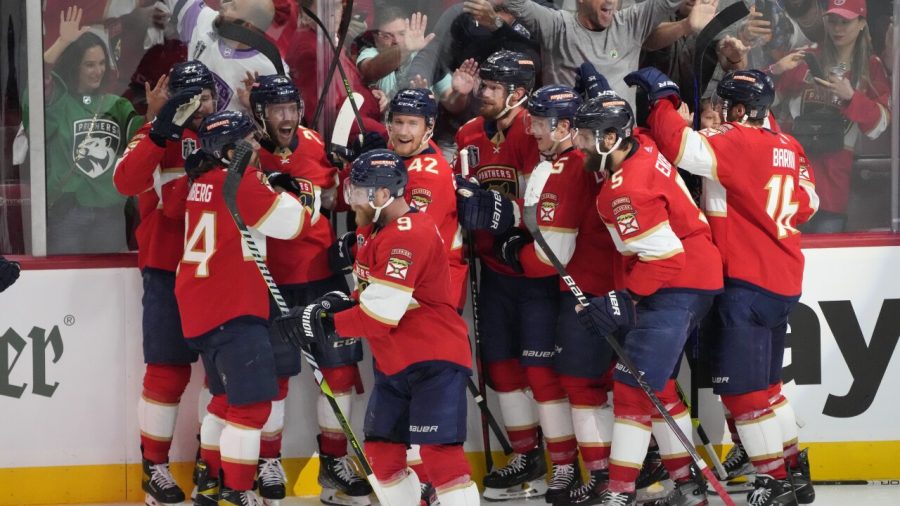 The+Florida+Panthers+celebrate+on+the+ice+after+Carter+Verhaeghe+scored+to+win+game+three.