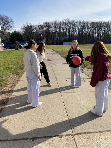 Eighth graders Marlee Mendelson, Maya Greenberg, Lila Aronowitz, and Mia Gerstenfeld play four square during recess. 