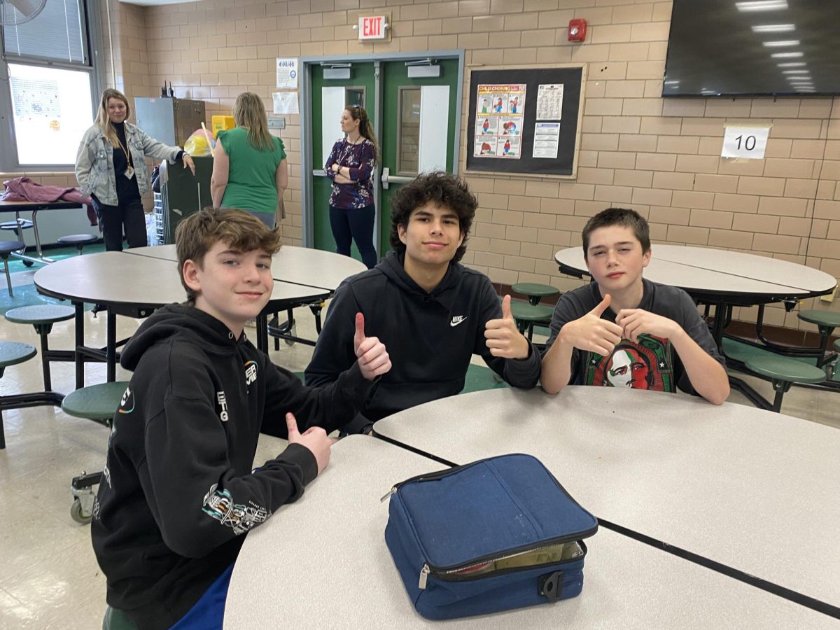 Eighth+grader+Jack+McKeon+likes+the+cookies%3B+Christian+Stepanov+eats+the+nachos+and+pizza%2C+and+Adel+Hamadallah+buys+cookies+at+the+EIS+cafeteria.