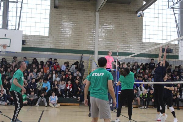 EIS teachers Dave Parke and Steve Markowski playing during the student teacher volleyball game. 