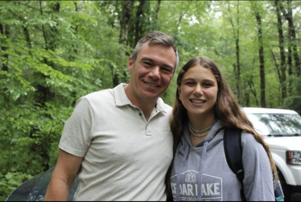 Eighth grader Abbie Schutman with her dad, Anthony, who dropped her off at Cedar Lake camp last summer. 