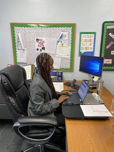 Vice Principal Ms. Jada Cole works in her office at EIS to help run the school. 