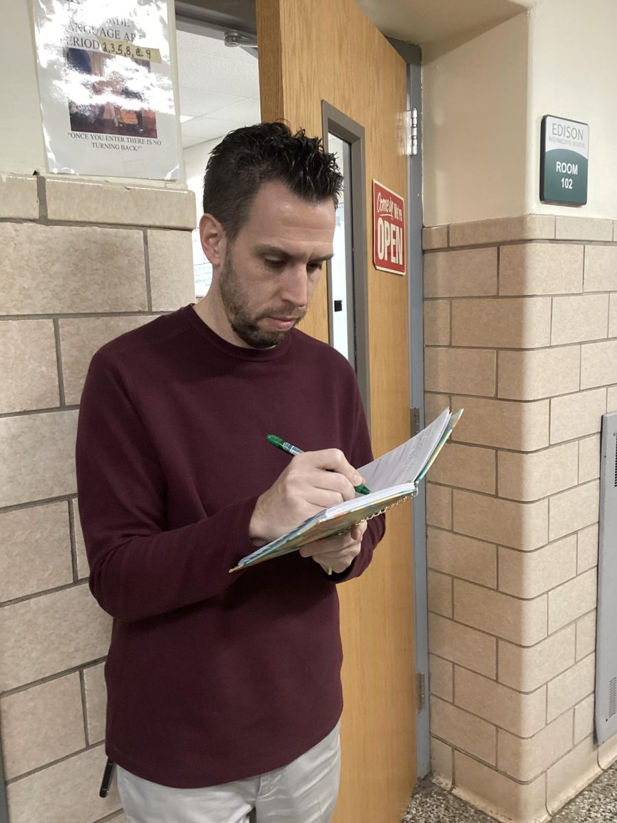 Seventh grade ELA teacher regularly writes his To-Do list in a planner to keep organized during the busy school day. 