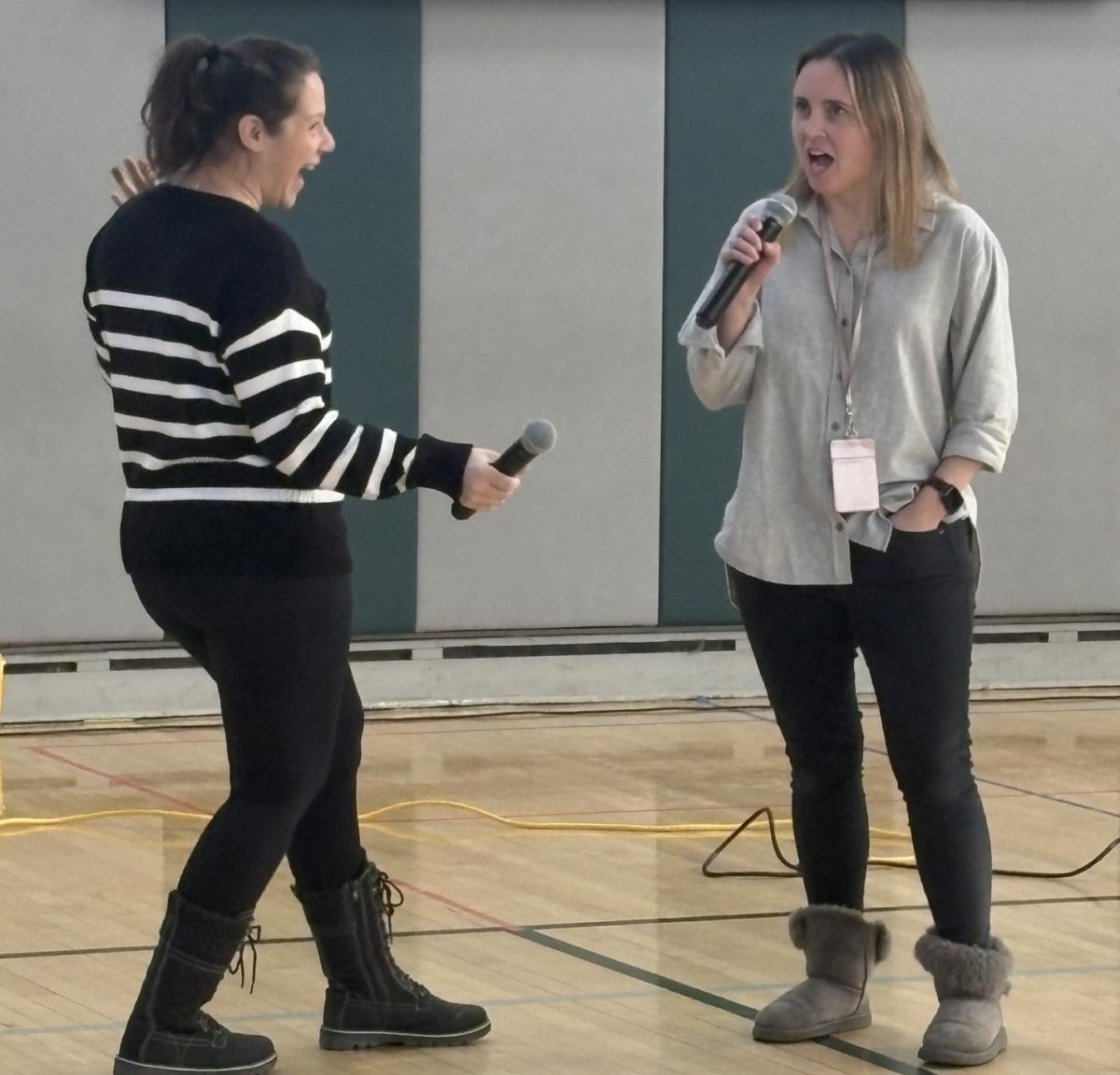 Mrs. Tamara Zuckerman and Mrs. Kristin Garcia role play during the decision making skits at the January assembly. 