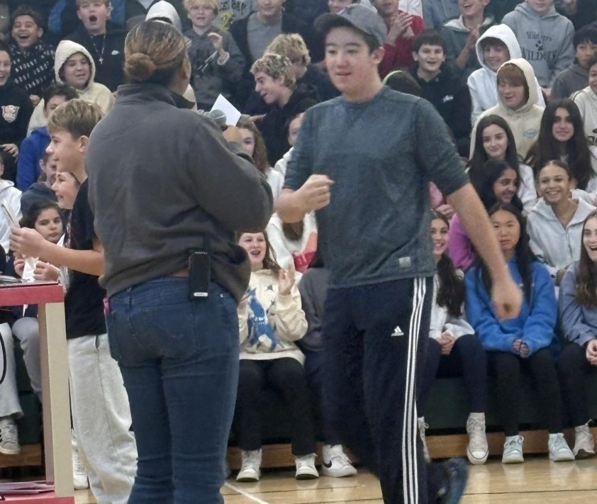 Seventh grader Sean Dunlap won the Student of the Month award in January.  Principal Mrs. LaNova Schall is giving him his certificate. 