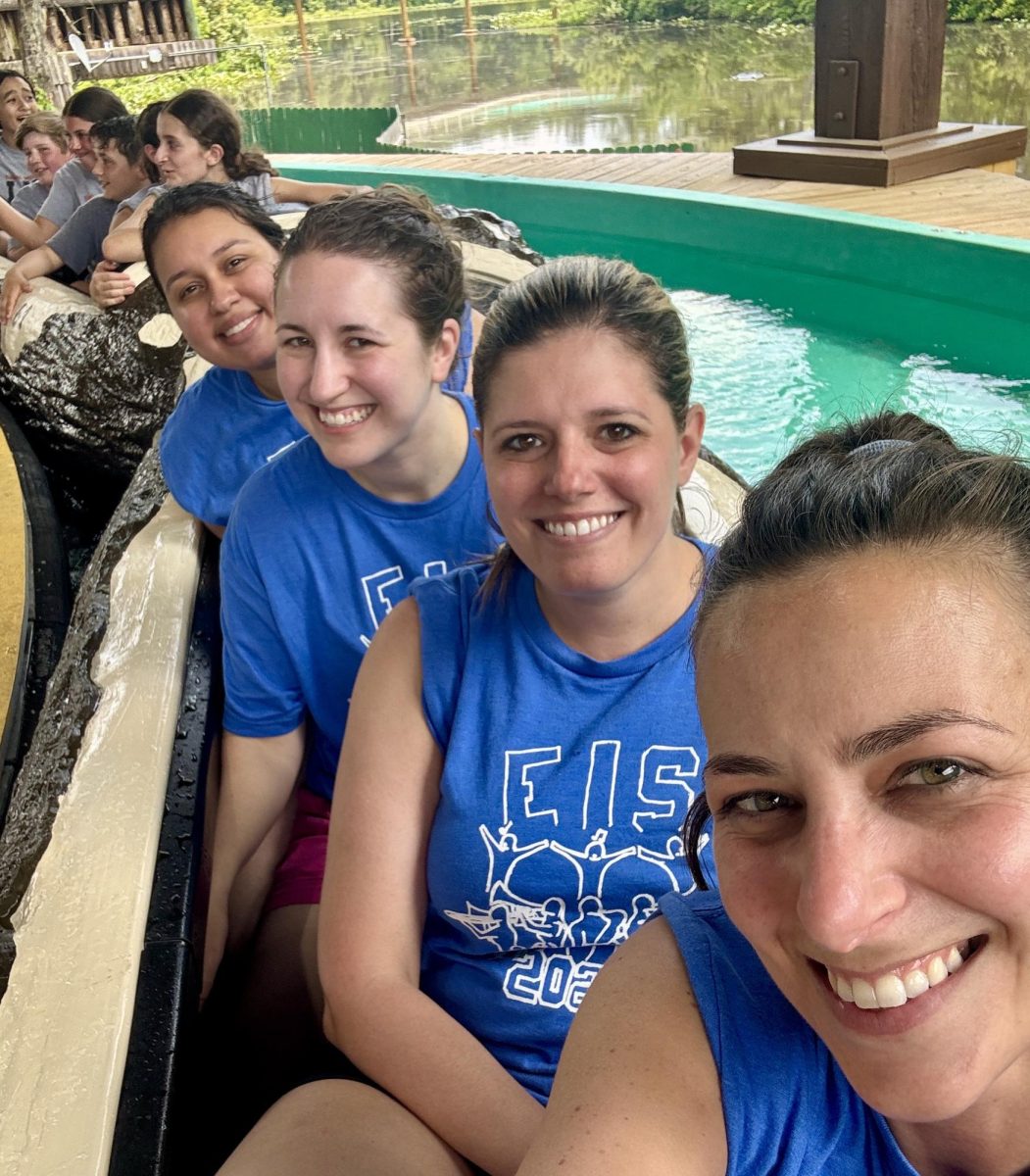 EIS teachers Mrs. Amanda Gant, Ms. Jenn Dow, Mrs. Willa Thayer, and Ms. Stephanie Grajales riding the log flume at Six Flags this June during a music field trip. 