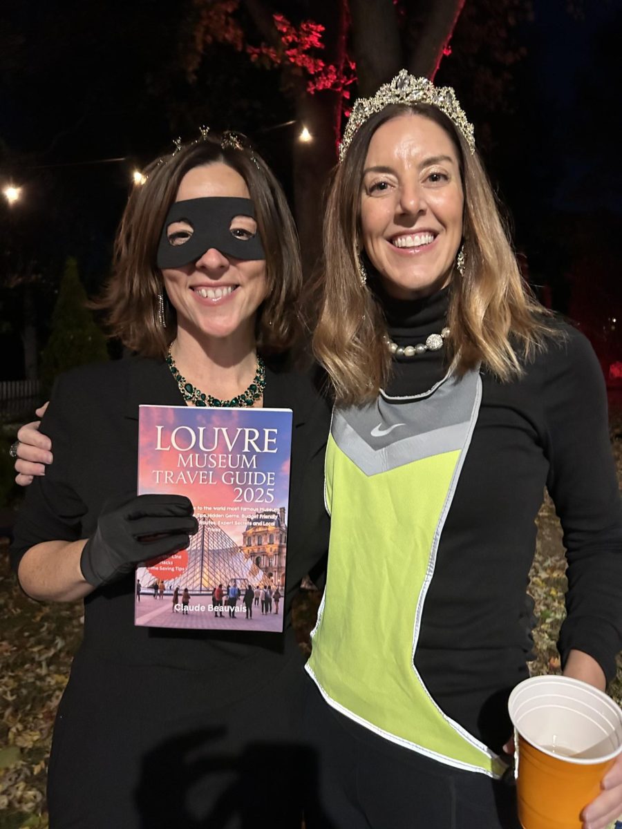 Eighth grade ELA teacher Mrs. Erin Meade's friends dressed as the Louvre heist for Halloween this year. Casey Kessler and Dana Papa are pictured here as bandits. 