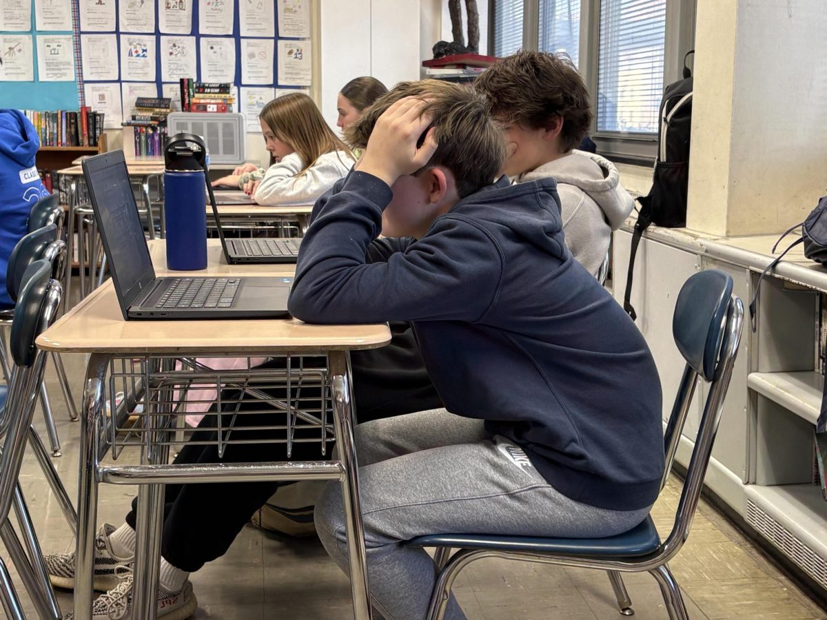 Eighth grade students Sean Ehrlich and Luke Denny are seen here working on their social justice websites. Are they stressed about making them perfect?