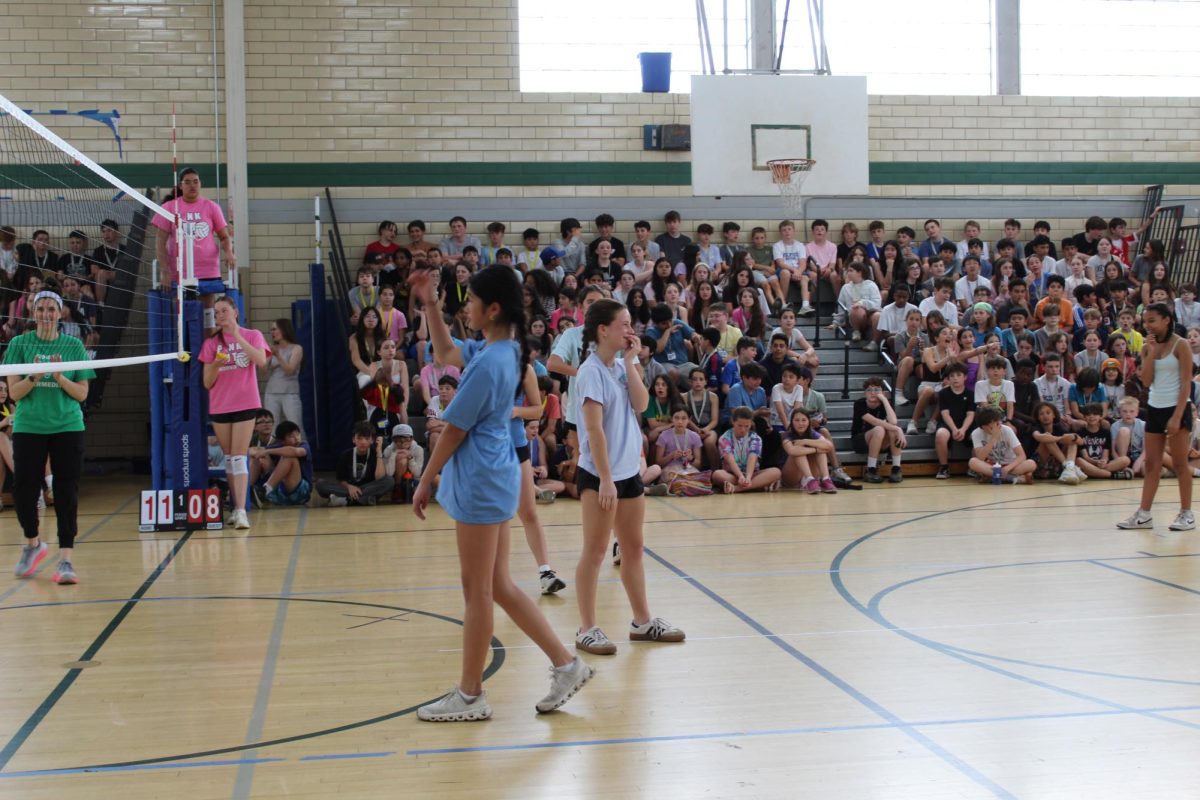 Blue team fights to win during the student vs. teacher volleyball game that took place at Edison Intermediate School. 