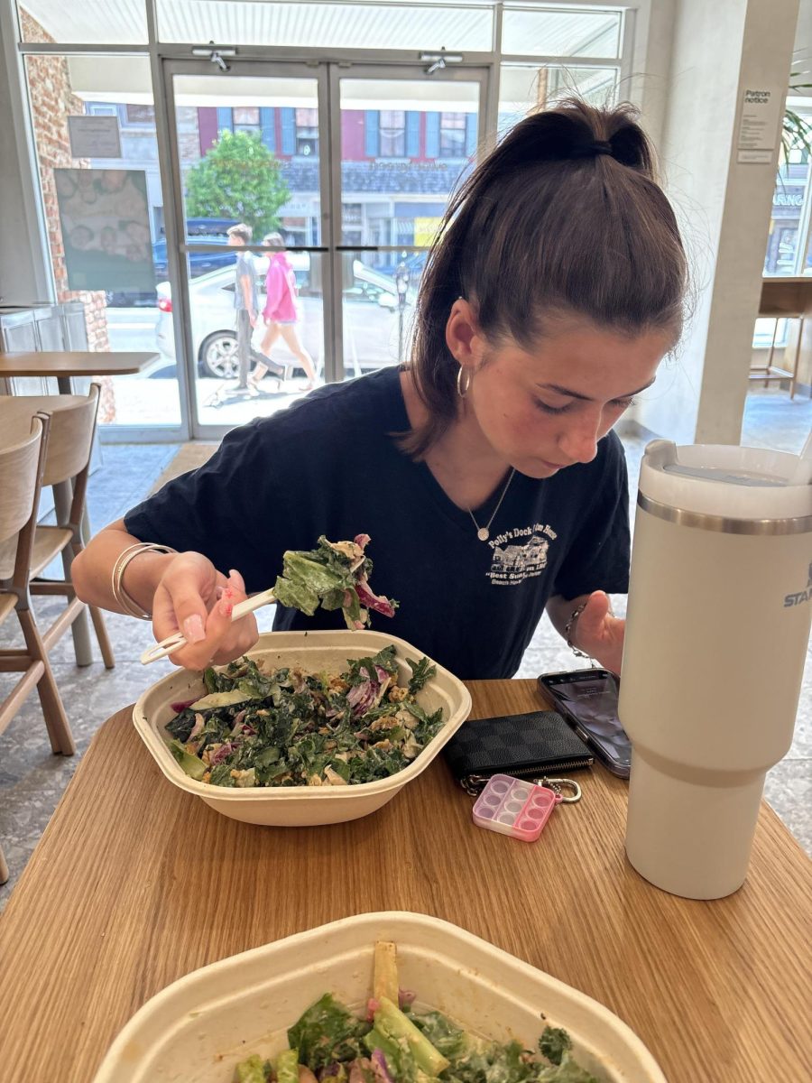 WHS senior Maggie Meade has time to eat lunch at Sweet Greens due to a flexible schedule. What would life be like if all students could relax and eat for an extended period of time during the school day?